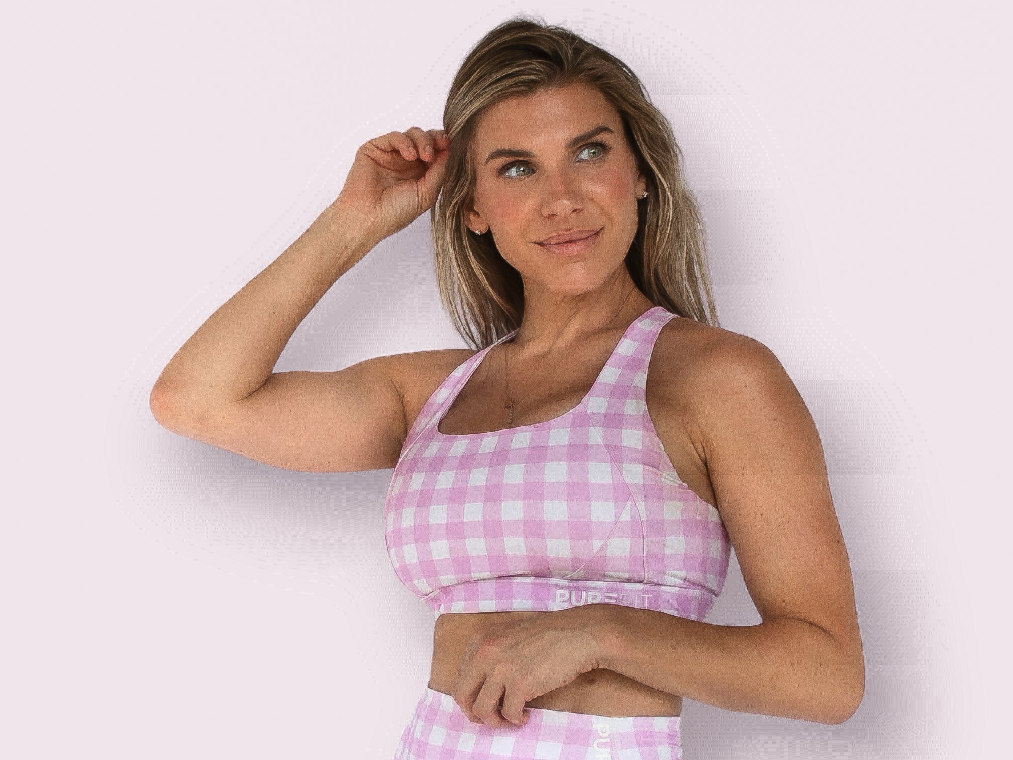 Model wearing Bubblegum Pink Savvy Checkers Sports Bra