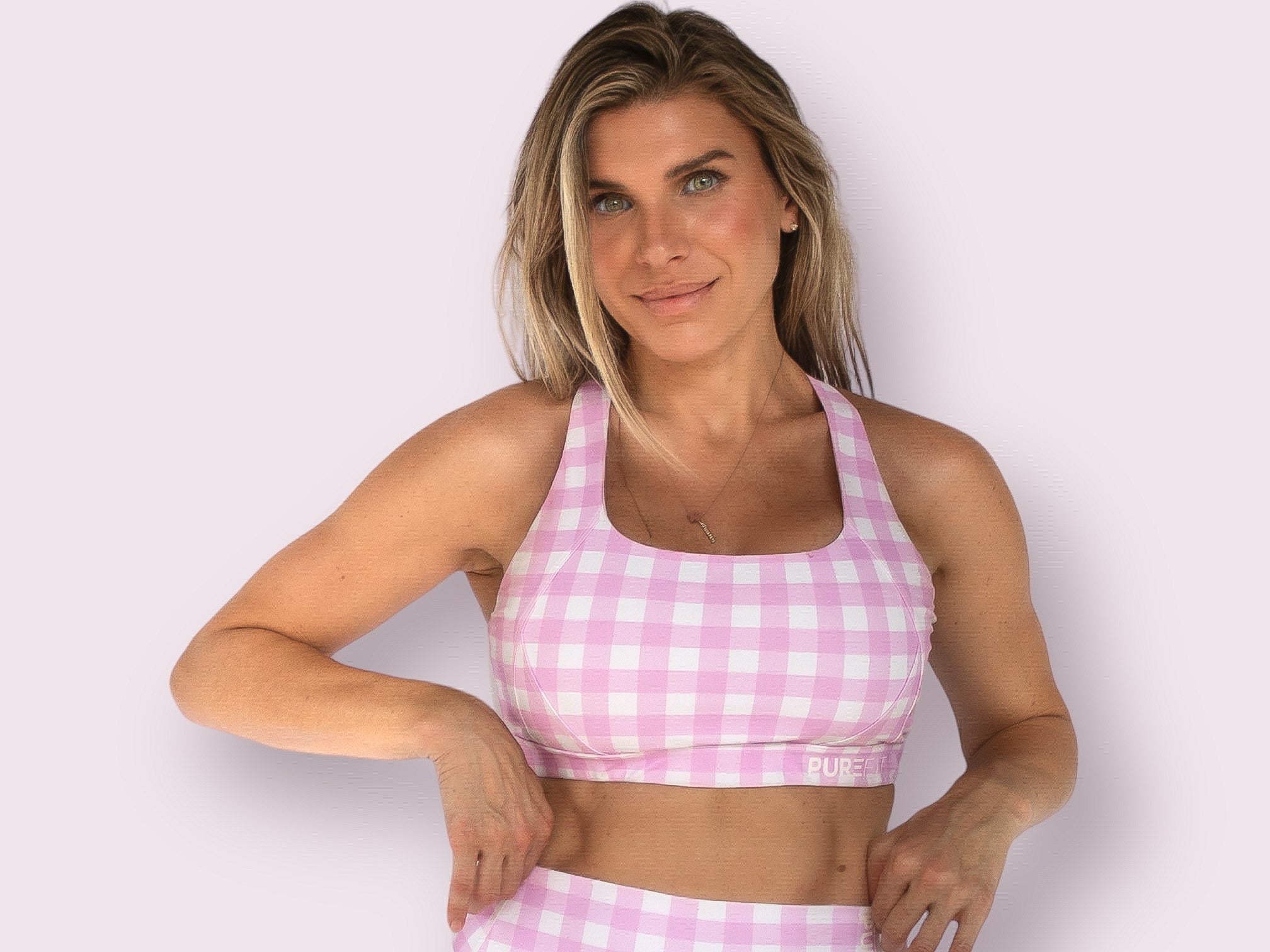 Model wearing Bubblegum Pink Savvy Checkers Sports Bra